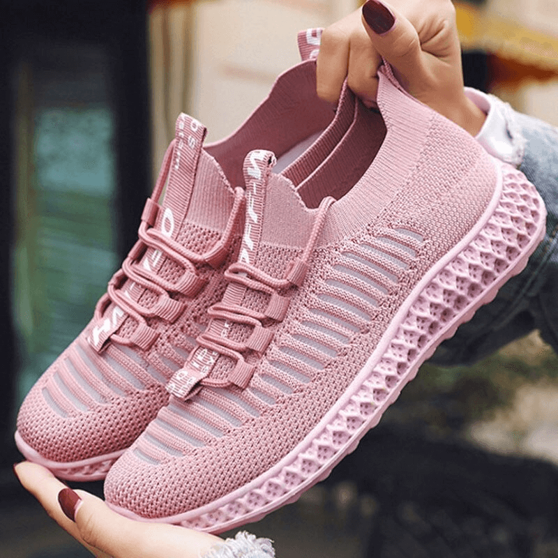 Pink casual lace-up mesh breathable sneakers for women, flat bottom, perfect for everyday comfort and style, shown in outdoor setting.